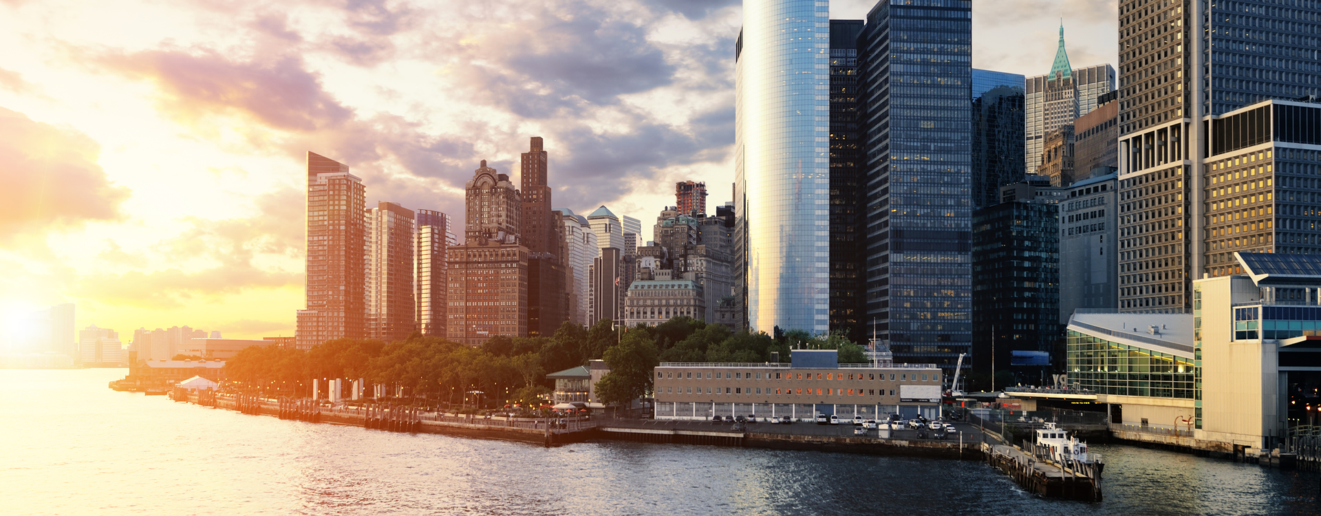 A beautiful scene of the sunset reflecting on urban skyline buildings