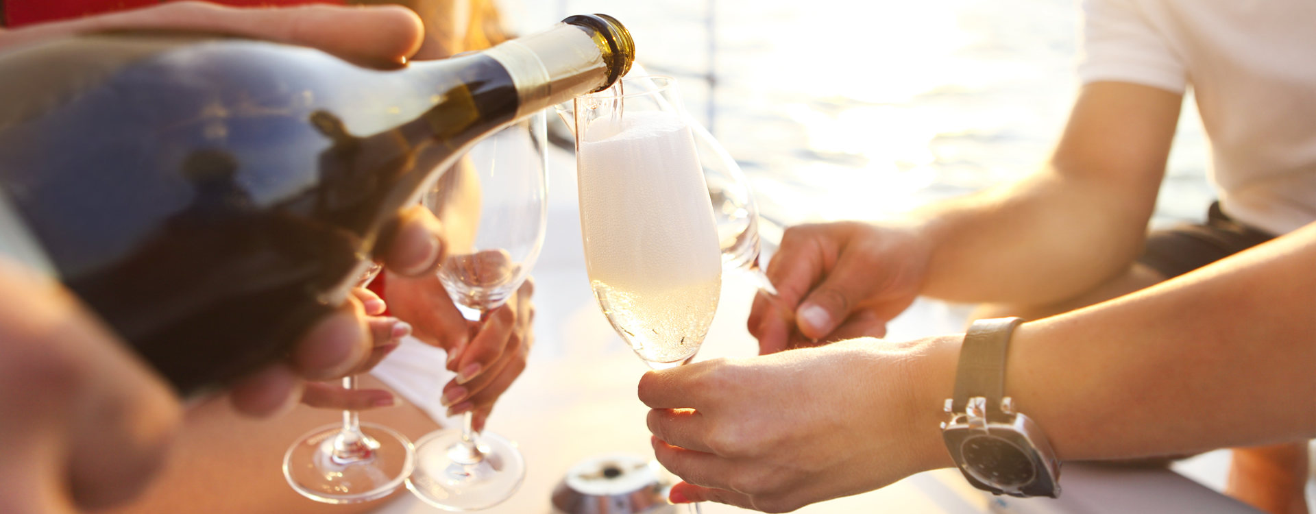Private yacht guests serving champagne during a special celebration