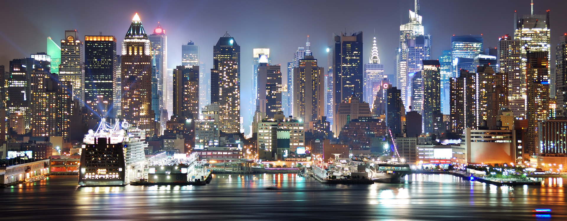 Stunning night view of the lightened buildings of the NYC skyline