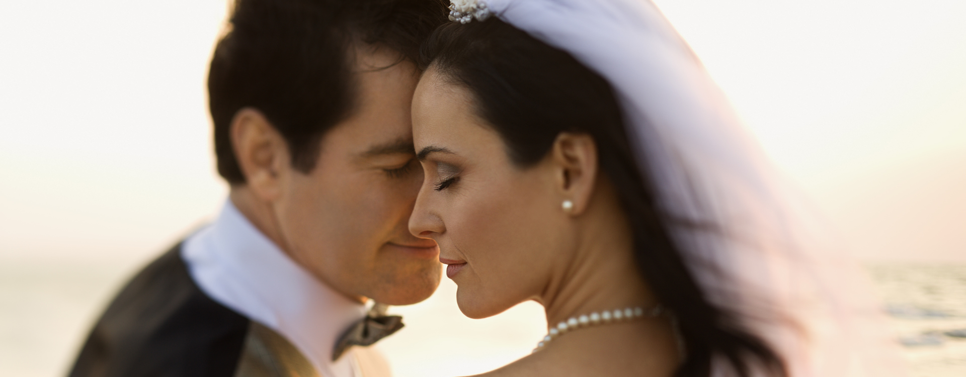 A couple celebrating their beach wedding on Cloud9 Charters